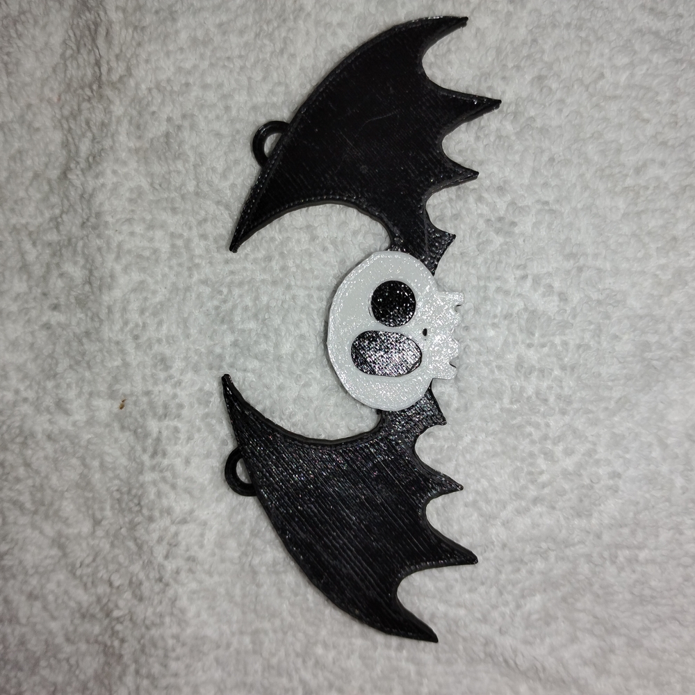 Black and White Bat-Shaped Accessory